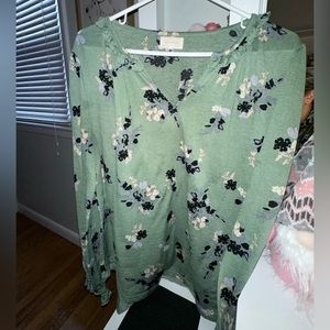 Green blouse with flower pattern